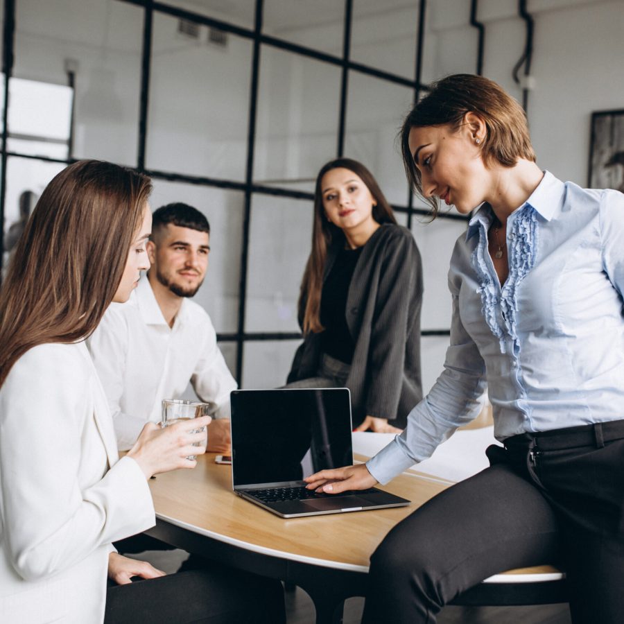 Group of people working out business plan in an office